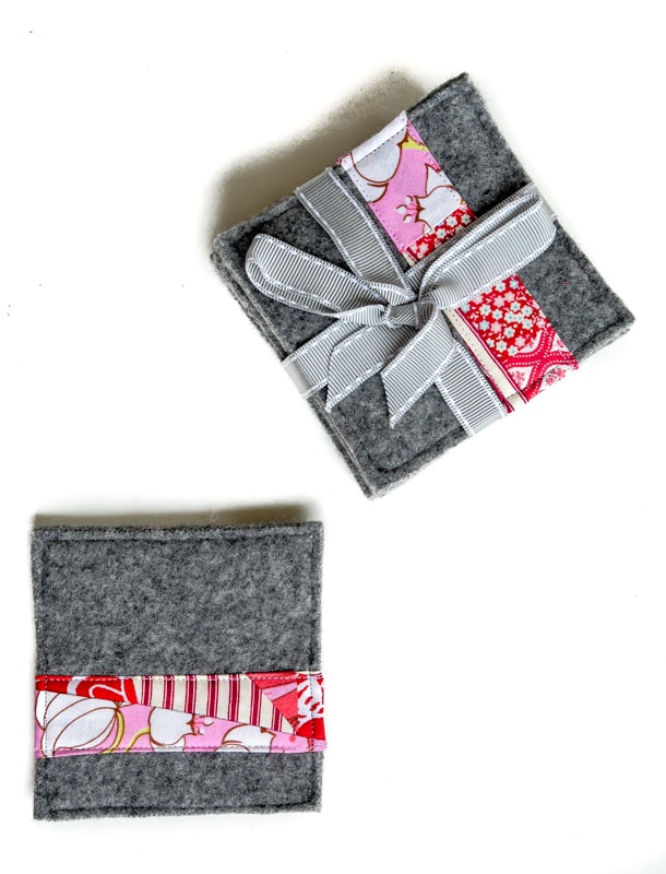 Create your own fabric scrap wool coasters. Use an old sweater and fabric scraps to create fun recycled Christmas coasters.