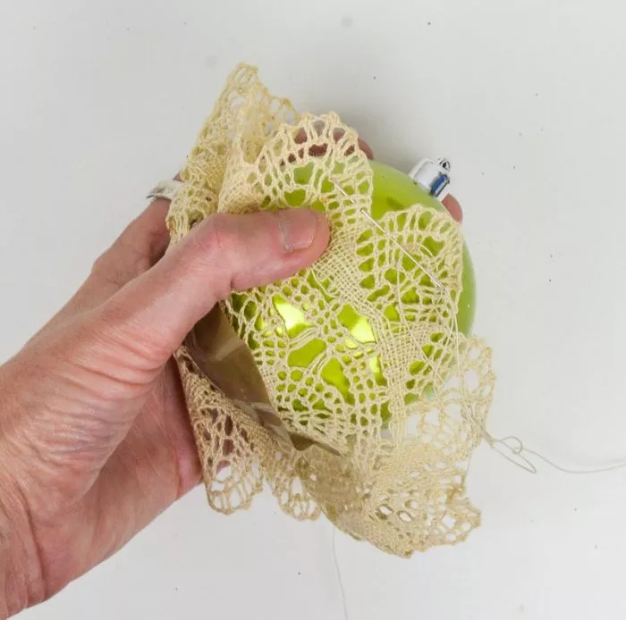 Transform your damily heirloom vintage doilies into upcycled Christmas decorations - super quick and easy to make add a vintage feel to baubles.