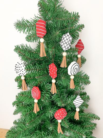 With some simple stitches and beautiful easy leather tassels, you will be wowing people with your DIY Candy Christmas Decorations 
 this holiday season.
