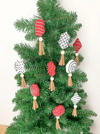 With some simple stitches and beautiful easy leather tassels, you will be wowing people with your DIY Candy Christmas Decorations
this holiday season.